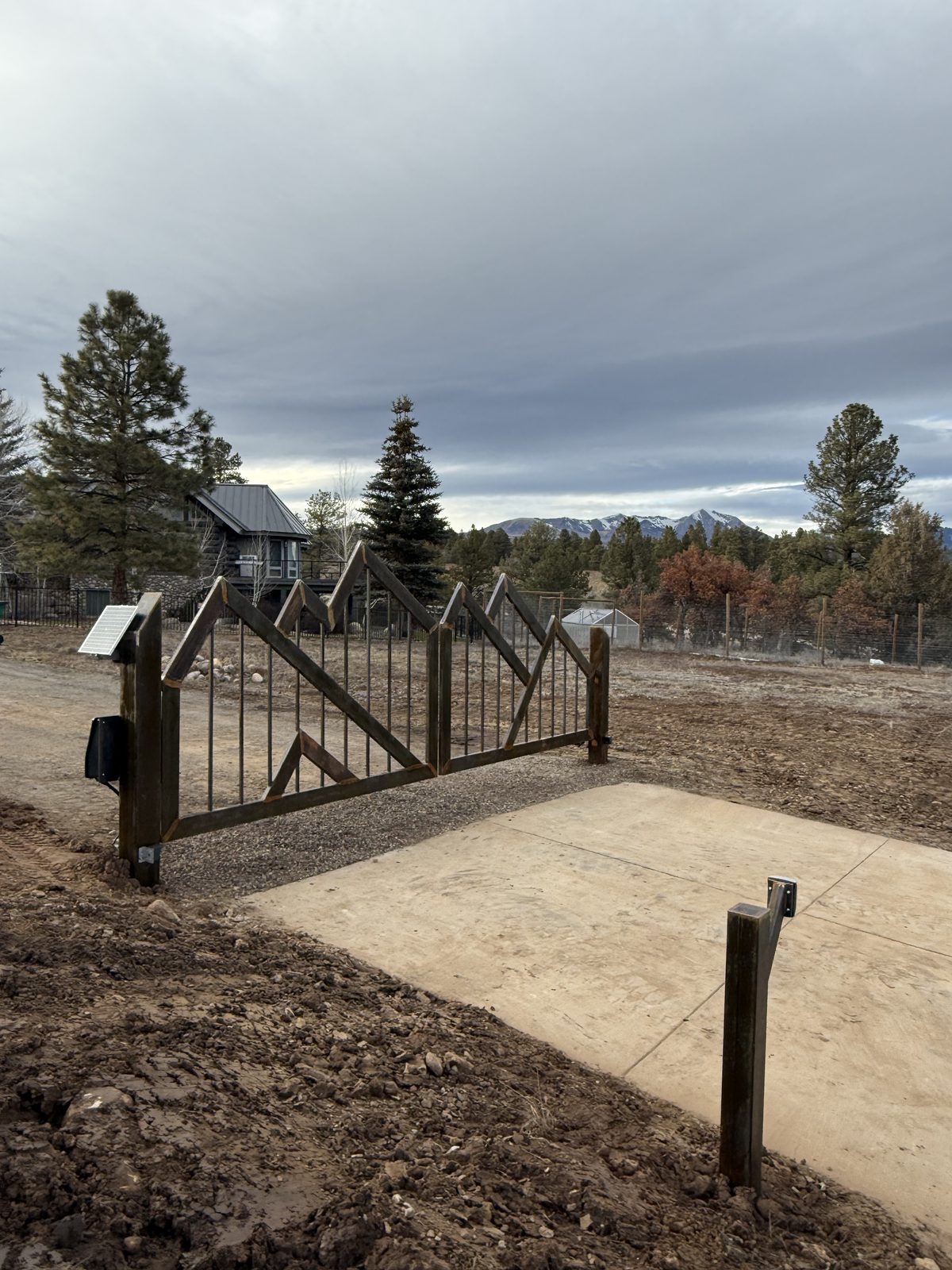 Dig Set Go Gate installed — heavy-duty US steel with Colorado mountain backdrop
