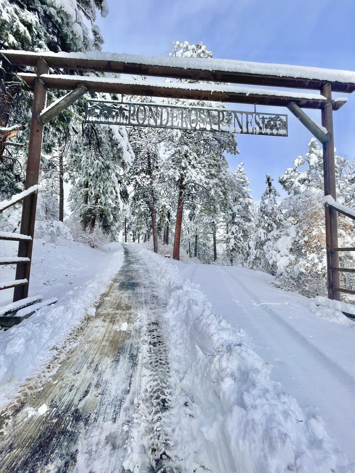 Custom Mountain Valley Welding entrance arch in winter